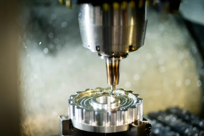 A CNC machine cutting a steel part