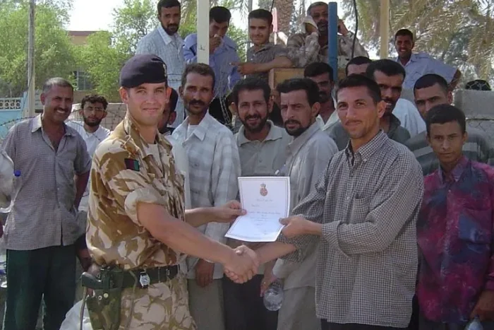 James Wakefield, then a British Army captain, presenting a certificate in Basra