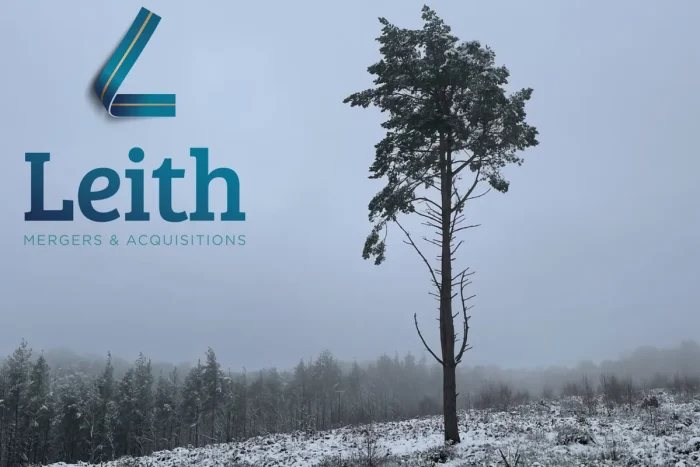 The Leith M&A logo over a pine tree on a snowy hillside